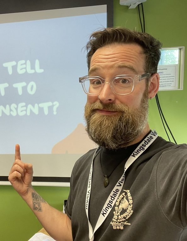 Dan Simpson pointing at a workshop slide about consent